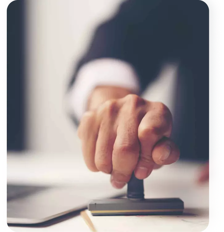 Employer reviewing and approving hiring paperwork